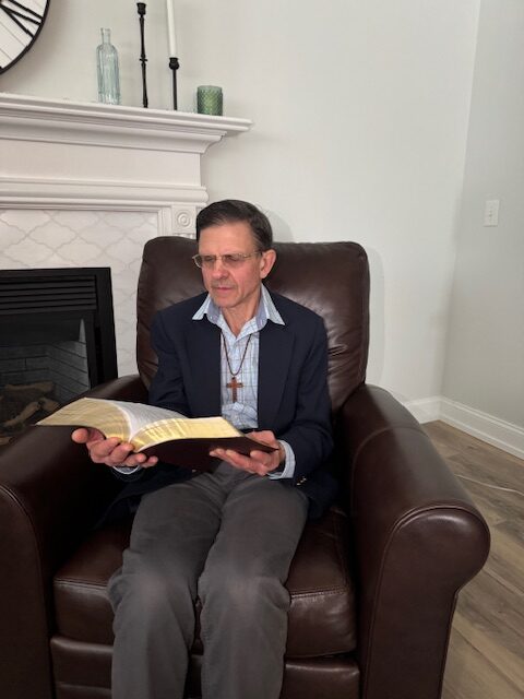 Author reading the bible Author reading the bible